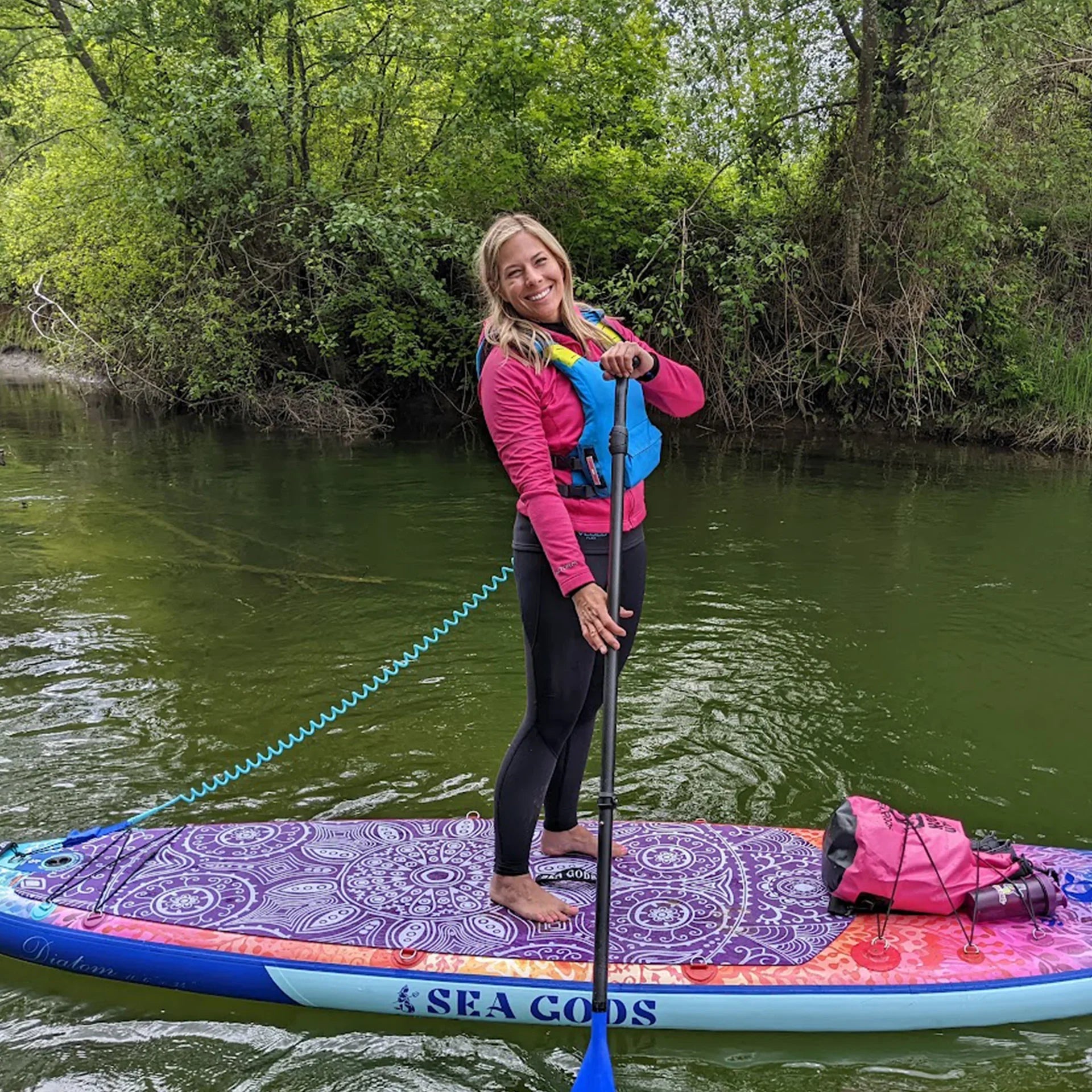 Woman on a stable inflatable paddle board