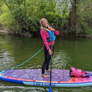 Woman on a stable inflatable paddle board